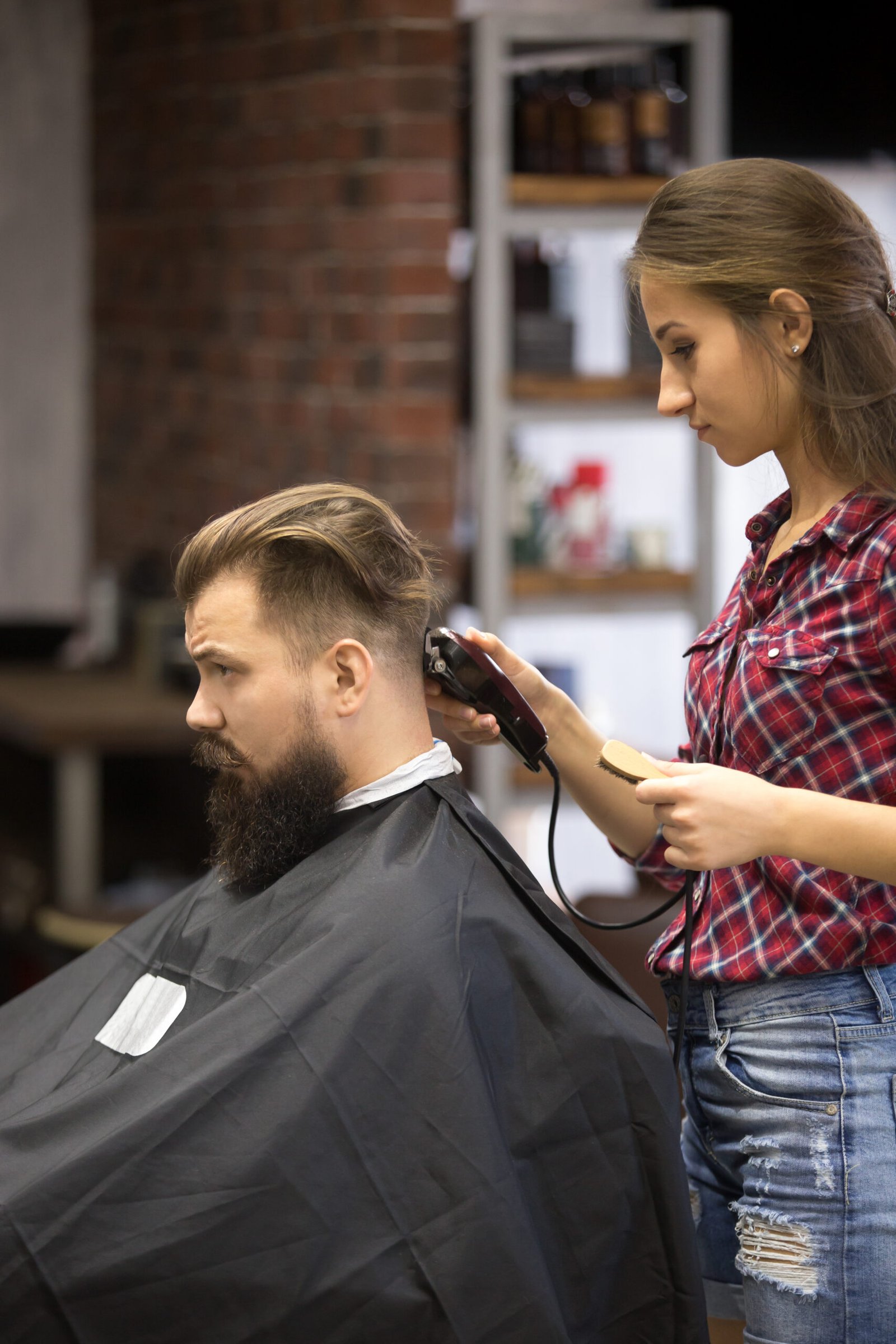Stylist at Knots Unisex Salon at work